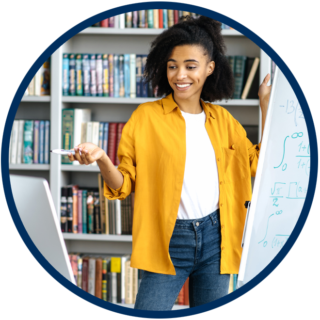Photo of female student using a whiteboard